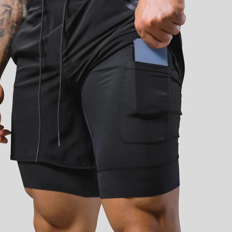 Men's double layer running shorts in light slate green and black, with built-in lining and mid-rise waist for fitness use