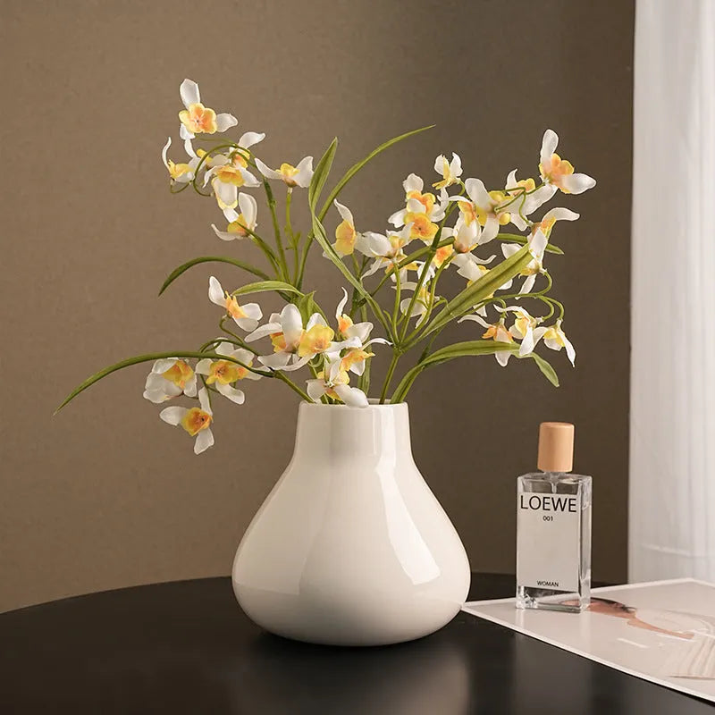 Ceramic decorative vase with orchid flowers in modern simplicity style