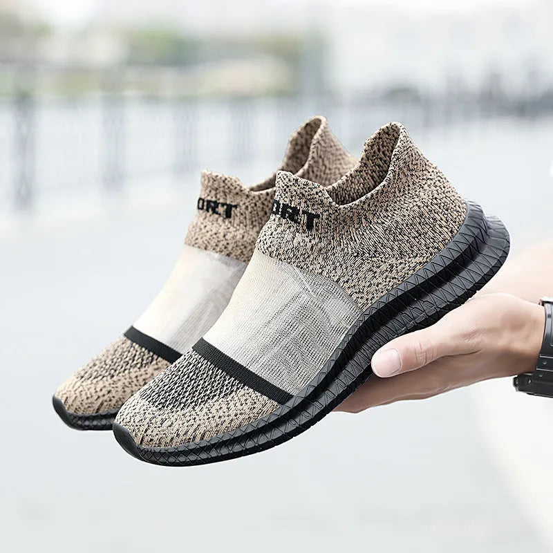 Flyknit casual sock shoes in khaki colour with lace-up front and tassel detail on a flat MD sole.