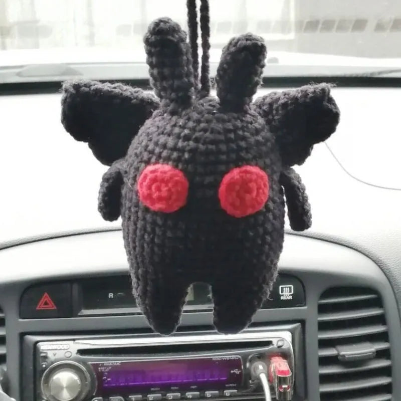 Plush hand-woven polyester automobile hanging ornament with cartoon style design on car dashboard