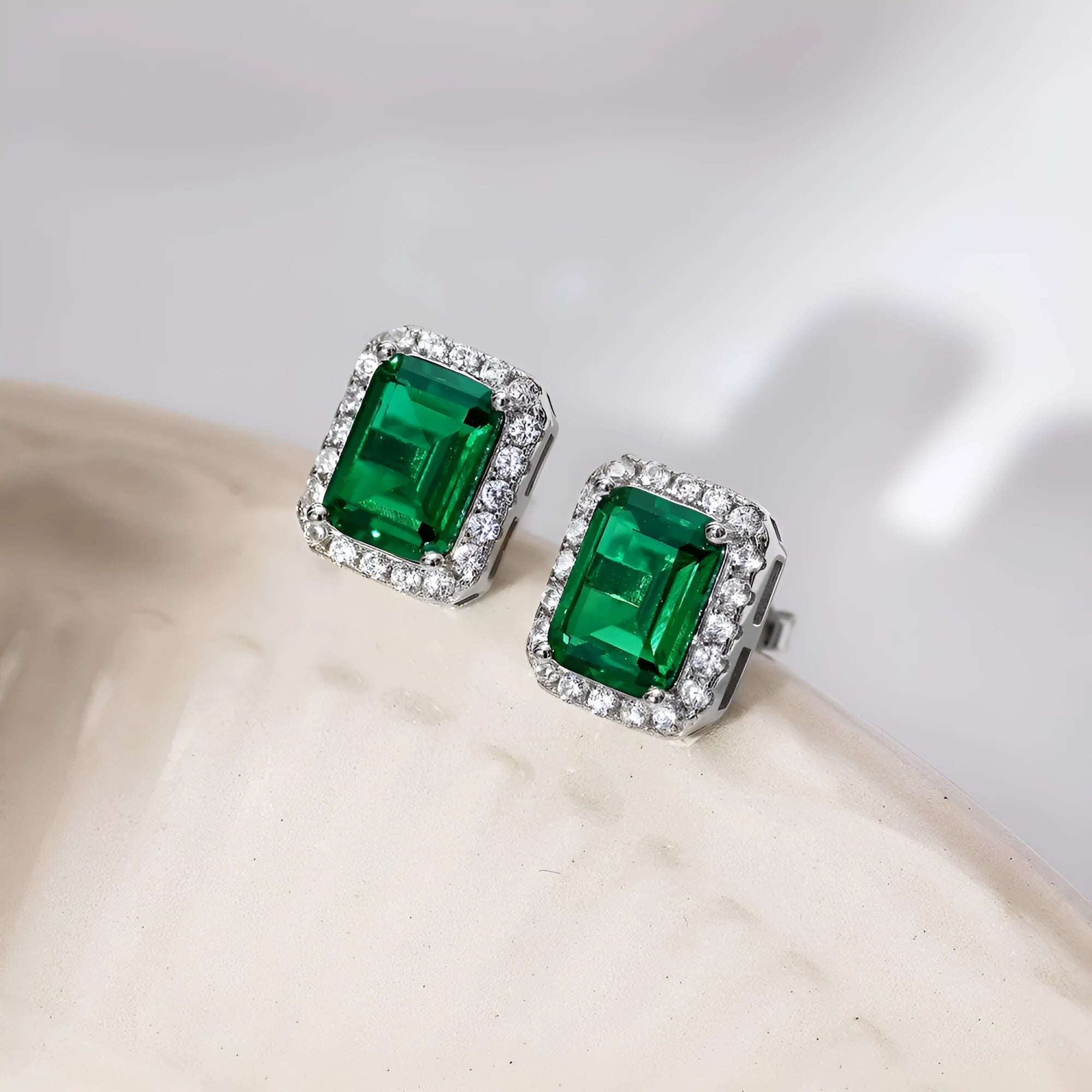 Diamond and emerald symmetry stud earrings in platinum 925 silver 8.5 x 10.5mm