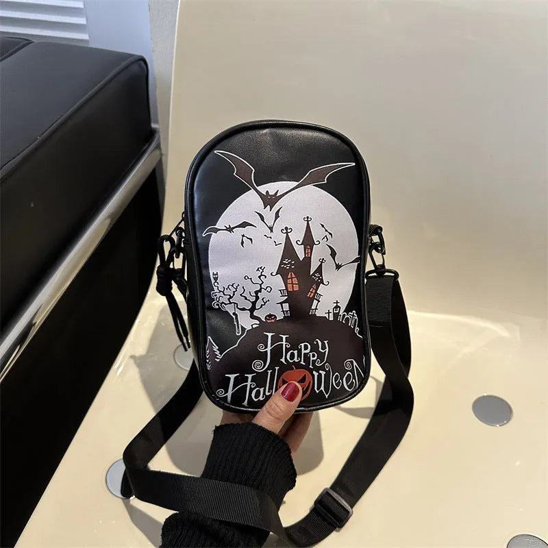 Black mini crossbody phone bag with Halloween graffiti print showing pumpkins, ghosts and bats