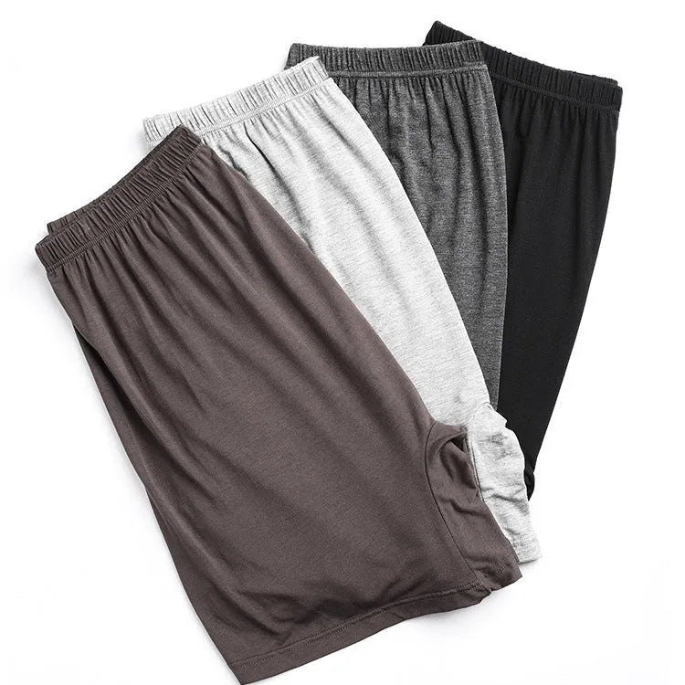 Solid colour high-waist men's modal boxers in black, brown, grey, and blue on a white background