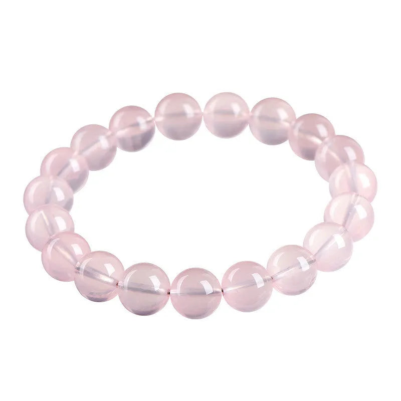 Women's natural starlight crystal round bead bracelet in pink, showing polished finish and single circle bead arrangement.