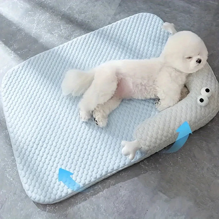 Blue big-eyed monster design pet bed cushion showing non-slip base and raised sofa style construction