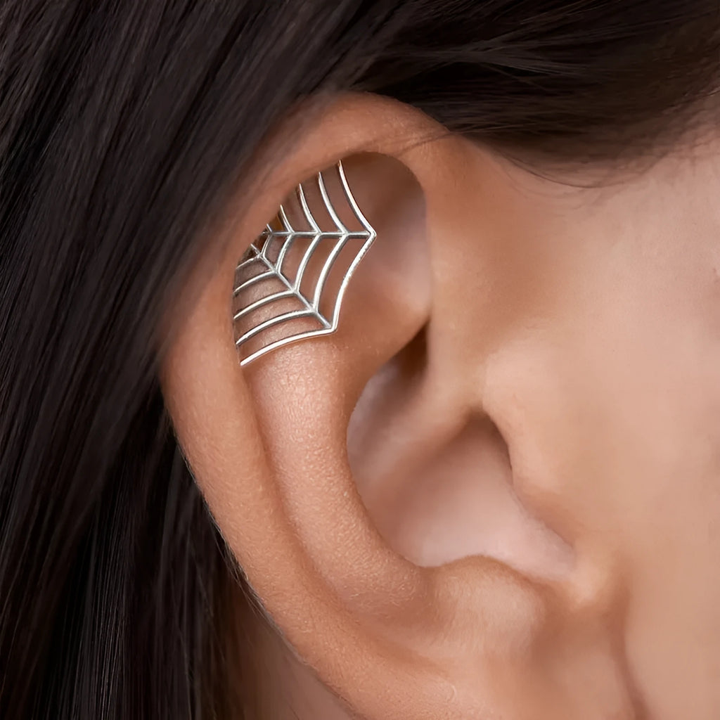 Spider web design stud earrings in gold and silver metal with geometric mesh pattern