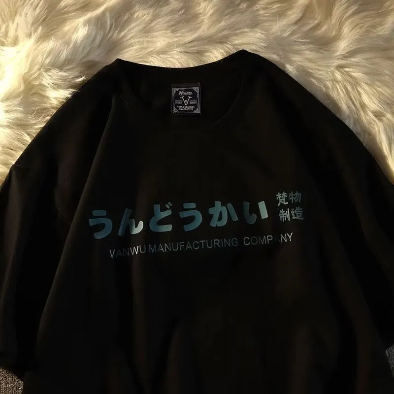 A loose-fitting black cotton t-shirt with a white letter print, shown on a hanger.
