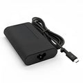 Black 65W USB-C laptop power adapter with set of international plug cords.