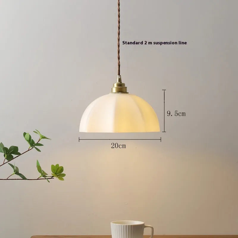 Brass small droplight with copper glass in a Chinese style design.