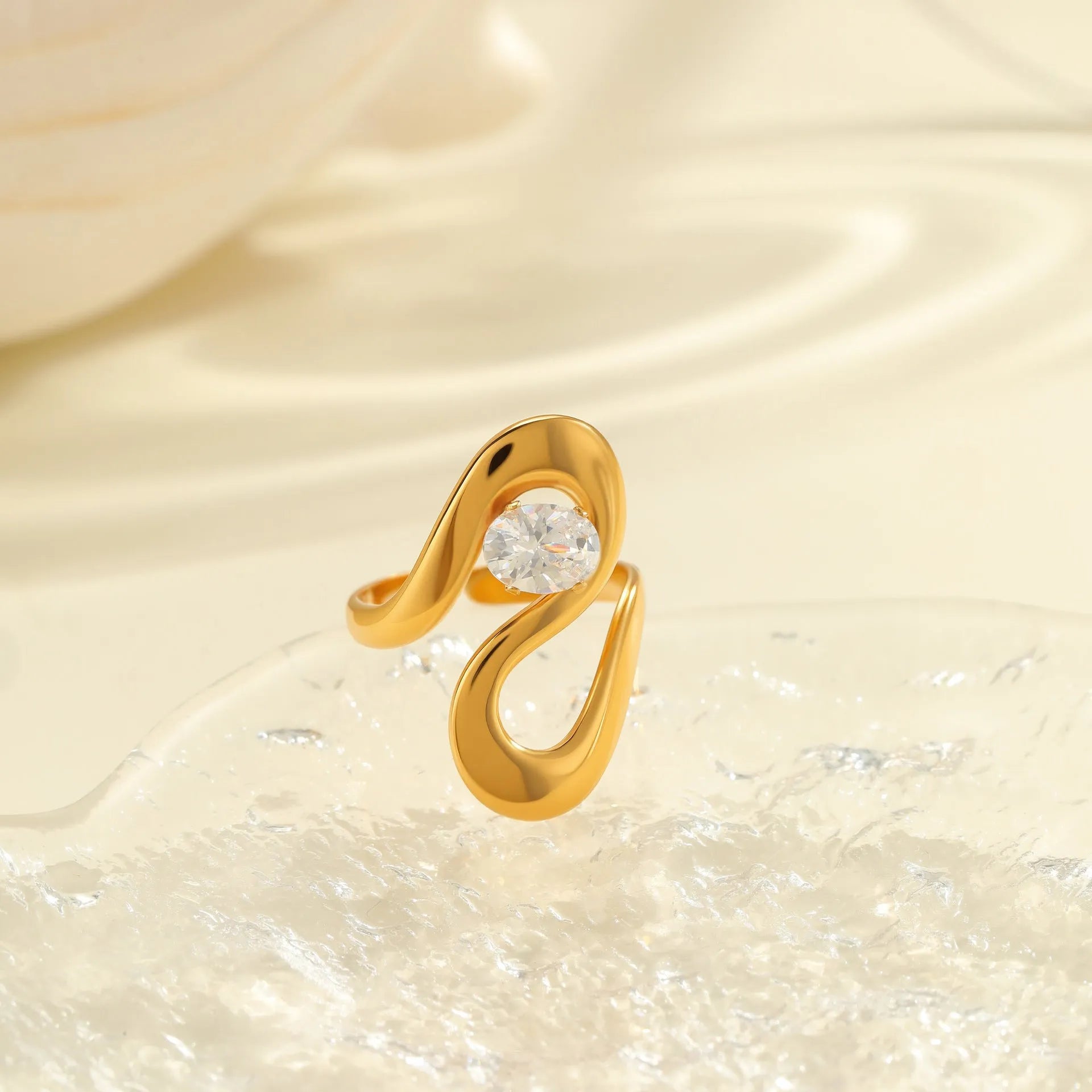 Adjustable geometric stainless steel ring showing open mouth design and colour variations