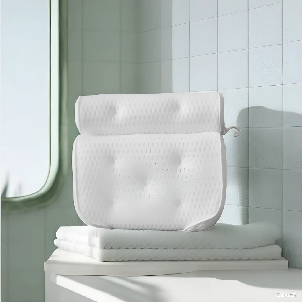 White 3D bathtub pillow with mesh fabric and suction cups on a bathtub edge.