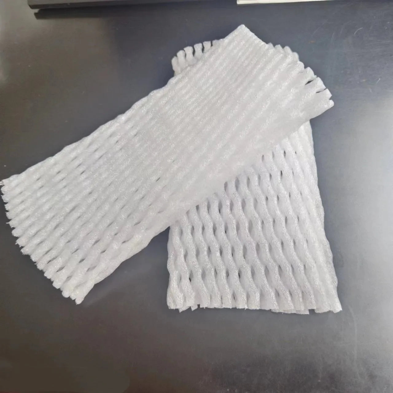 White foam mesh net protective cover for fruit, shown with size options from 6x5cm to 18x7cm.