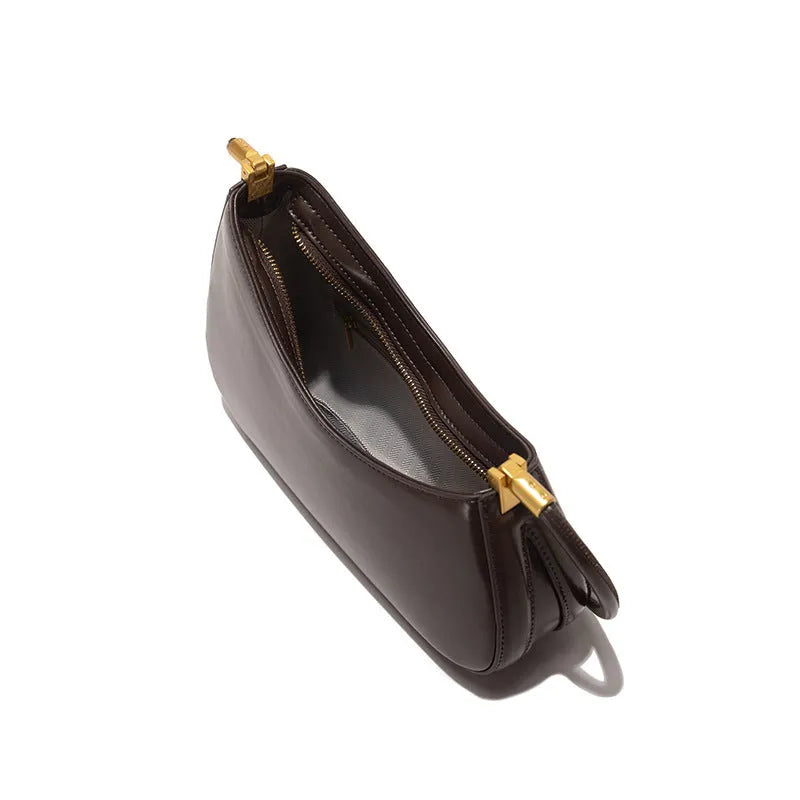 Women's retro oval underarm bag in PU with single strap and internal zip compartment, shown in multiple colour options