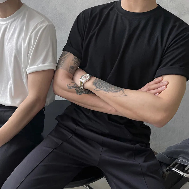 Men's slim fit black cotton t-shirt with round neck and half sleeves on a hanger