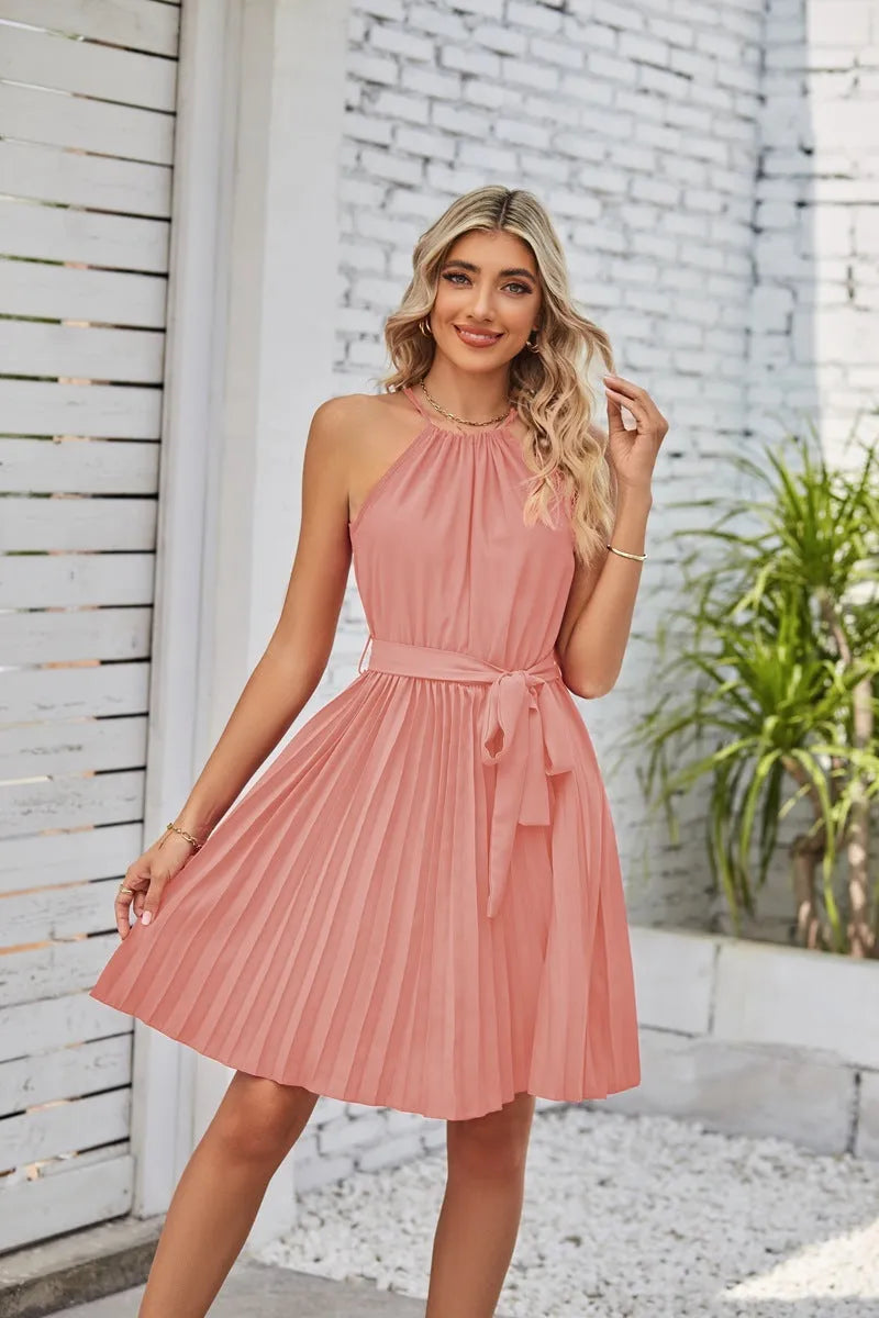 Women's black halter neck strapless sundress with a pleated midi skirt and an adjustable waist belt.