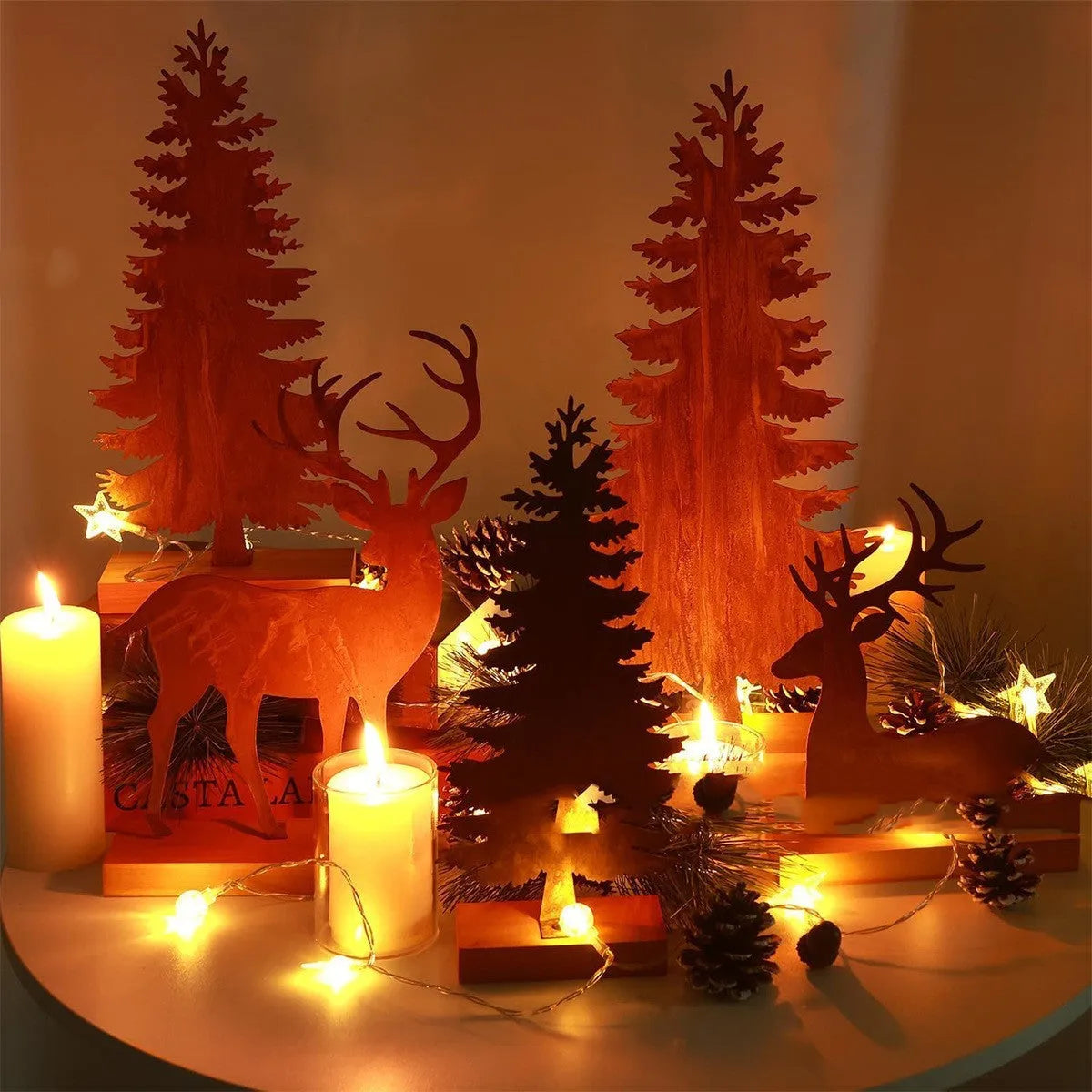 Set of three rusty iron elk and Christmas tree metal ornaments on a wooden surface.