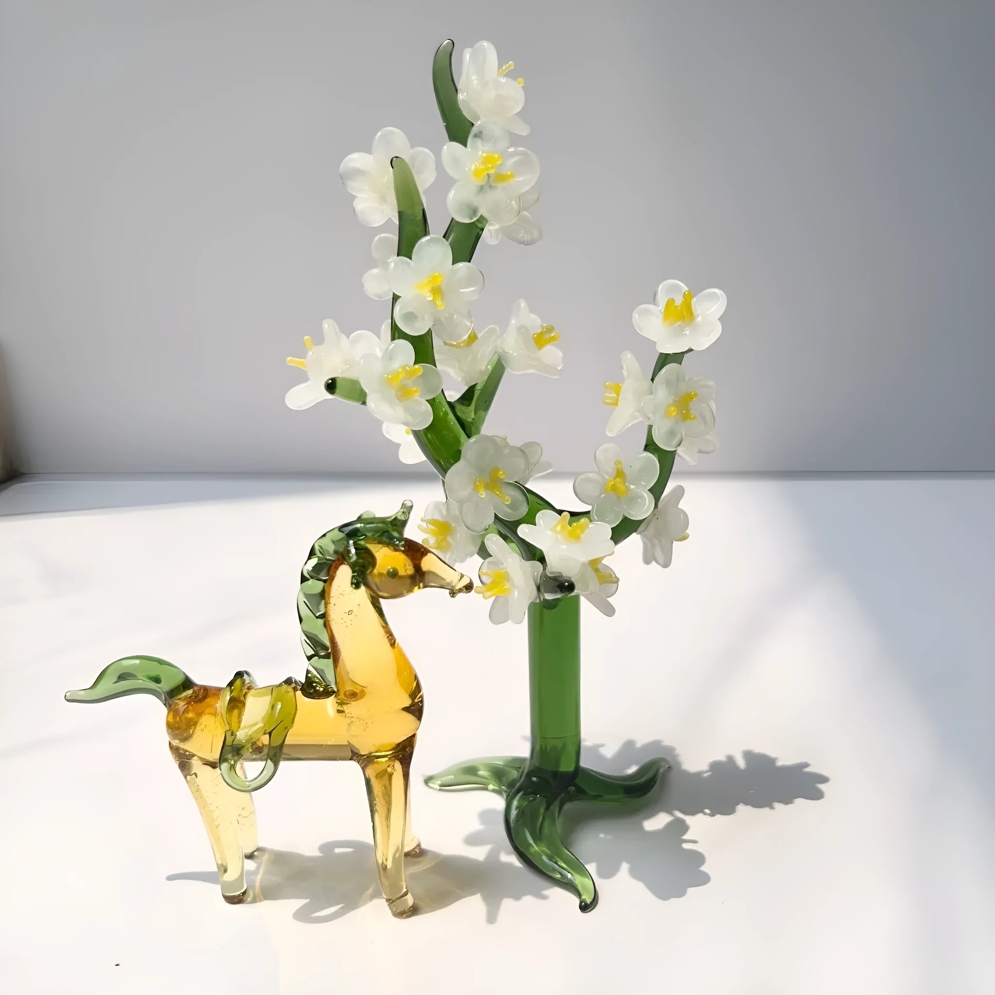 Glazed brown horse figurine on wooden desk as office decoration