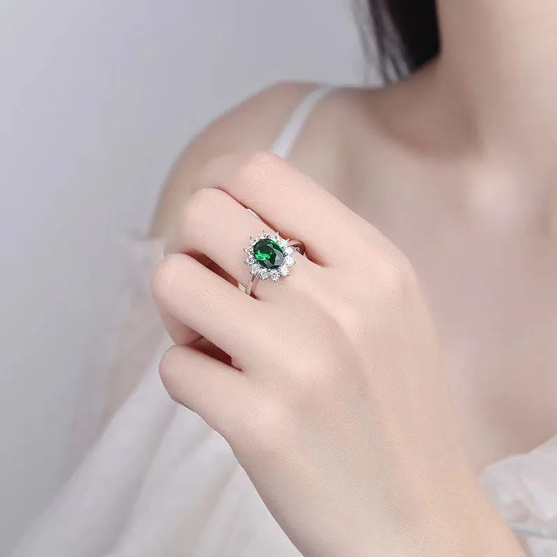 Copper flower-shaped women's ring with zirconium inlay, shown in green, blue, or red electroplated finish.