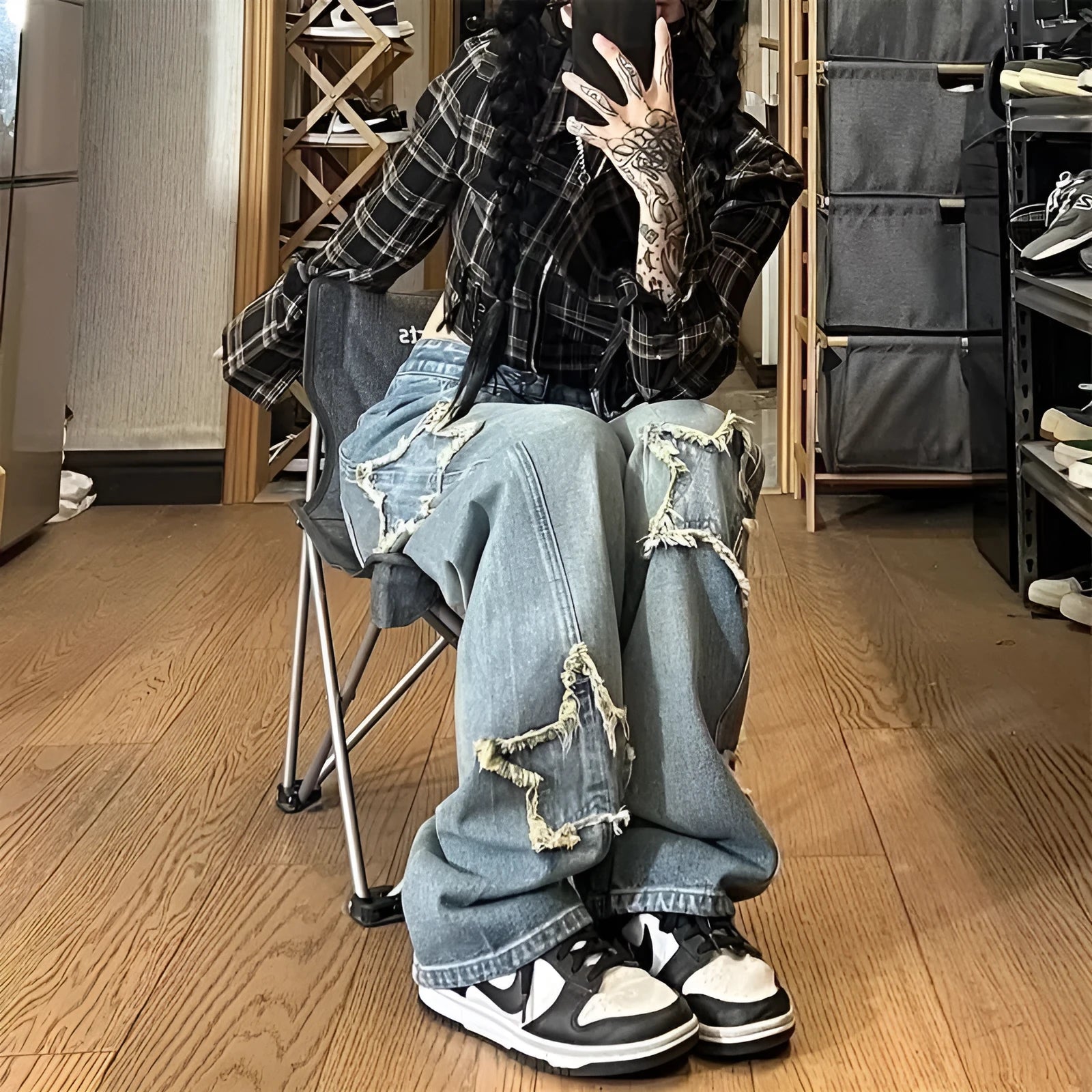 Blue high-waist wide-leg denim trousers with straight cut on mannequin