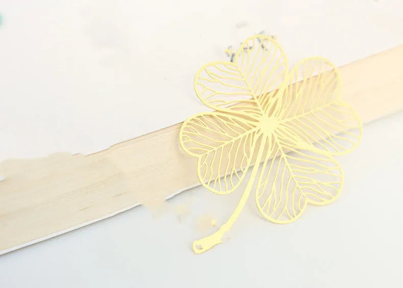 Brass bookmark with hollow-cut leaf design and matching rose gold metal tassel