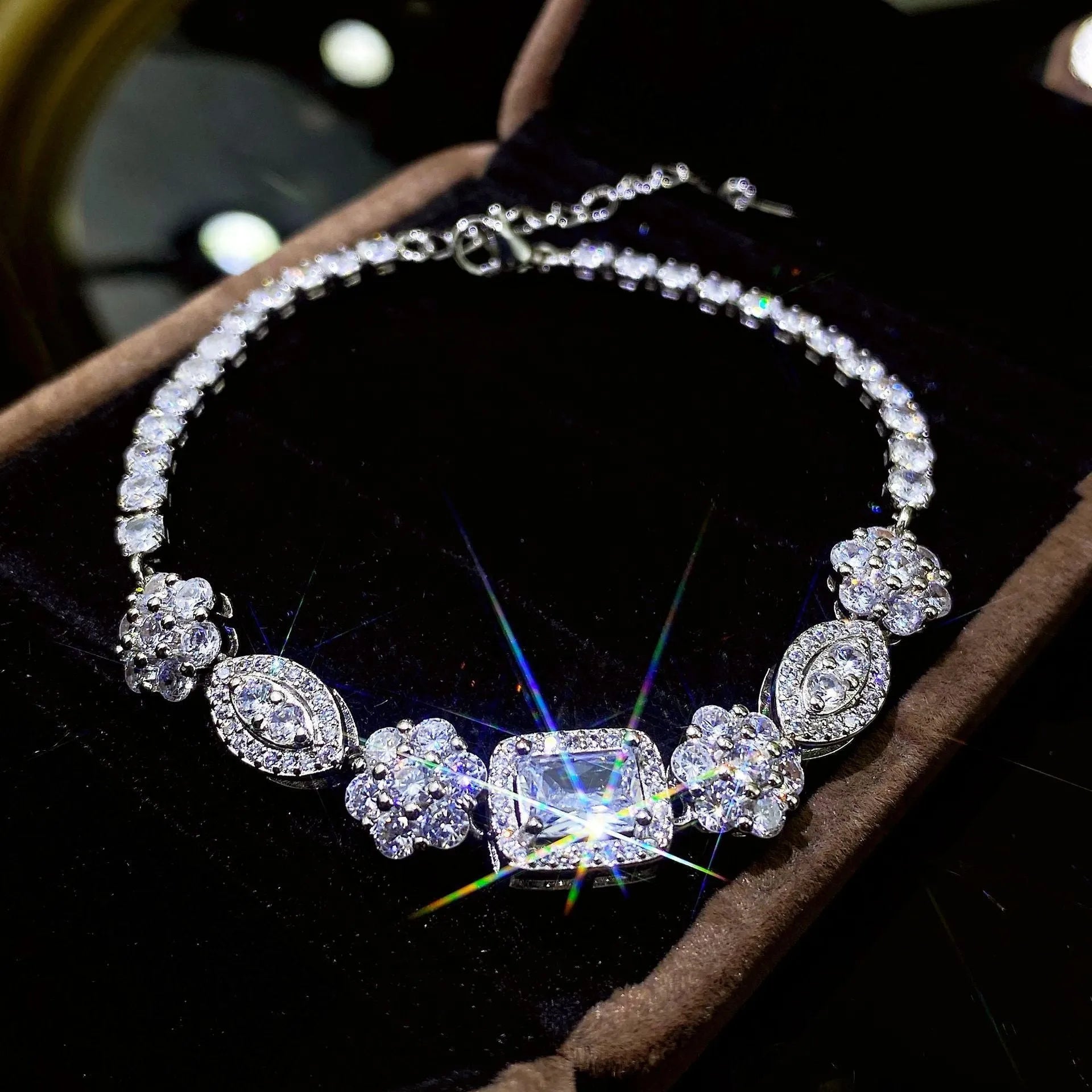 Women's sterling silver-plated bracelet with white gold finish and inlaid zircon stones.