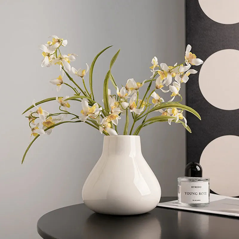 Ceramic decorative vase with orchid flowers in modern simplicity style