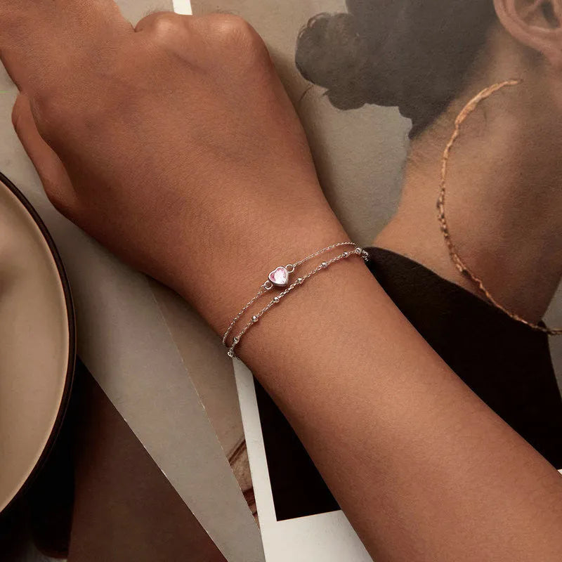 Sweet girlish style 925 sterling silver bracelet with a small heart-shaped pendant on an adjustable chain.
