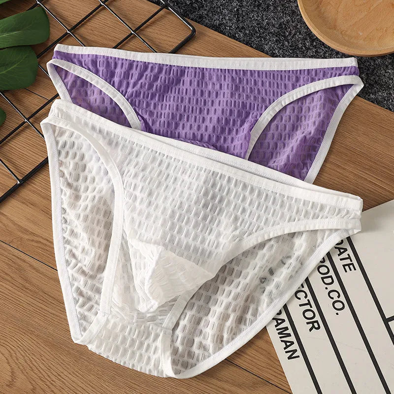 Men's low waist transparent lace underwear in a choice of colours on a size chart.