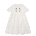 White washed cotton girls dress with short sleeves, ruffled and embroidered skirt for summer