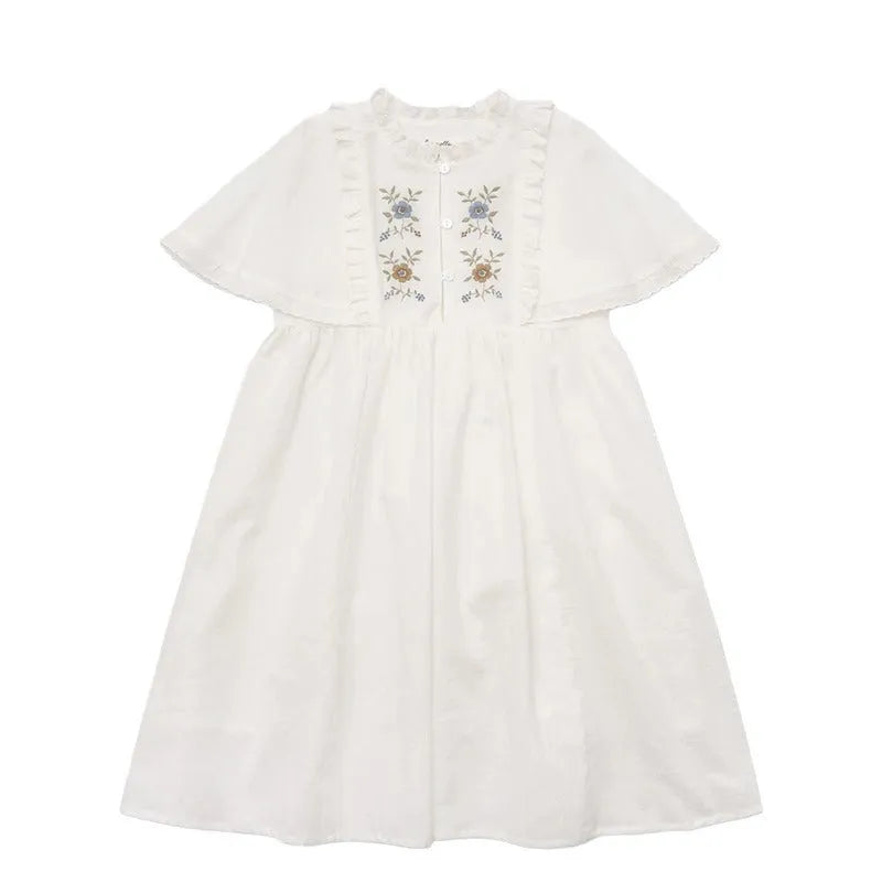 White washed cotton girls dress with short sleeves, ruffled and embroidered skirt for summer