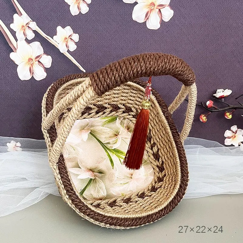 Coffee brown hand-woven hemp rope basket with straw trim, shown from the side.