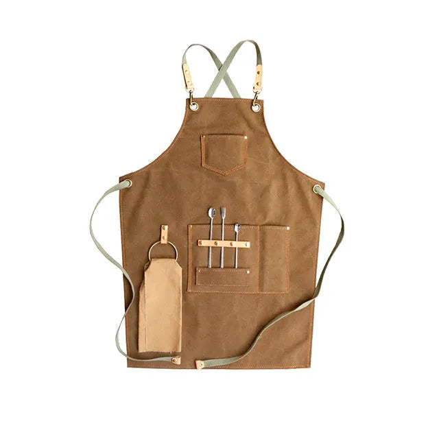 Canvas apron with cross-back straps in camel colour for cafe or baking work