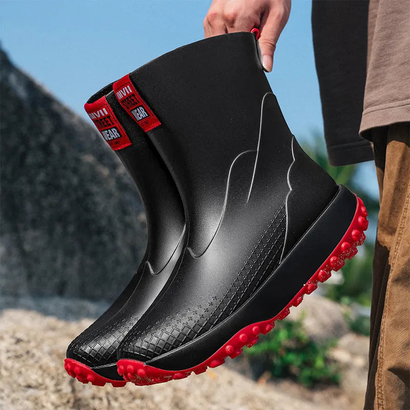 Men's mid tube PVC rain boots in black with non-slip plastic sole, round toe, flat heel