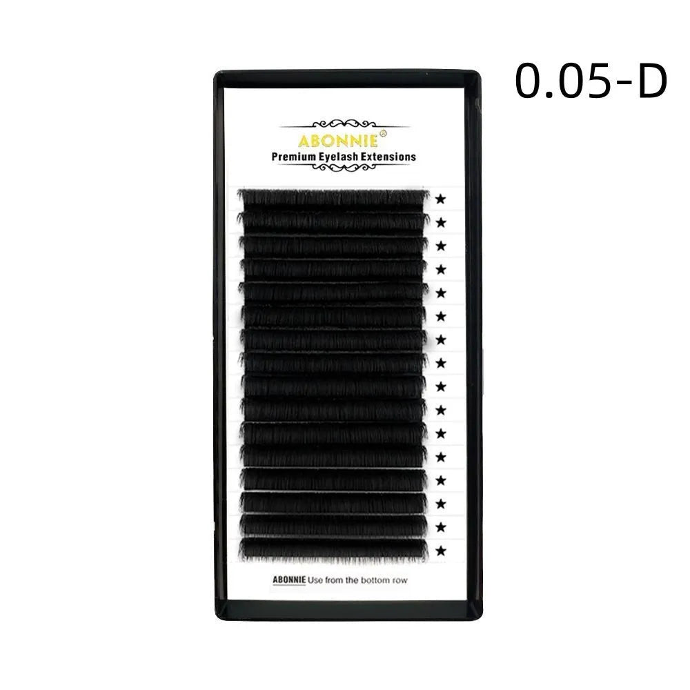Pair of dense 16-row false eyelashes made from matte wool mink hair, showing voluminous length.