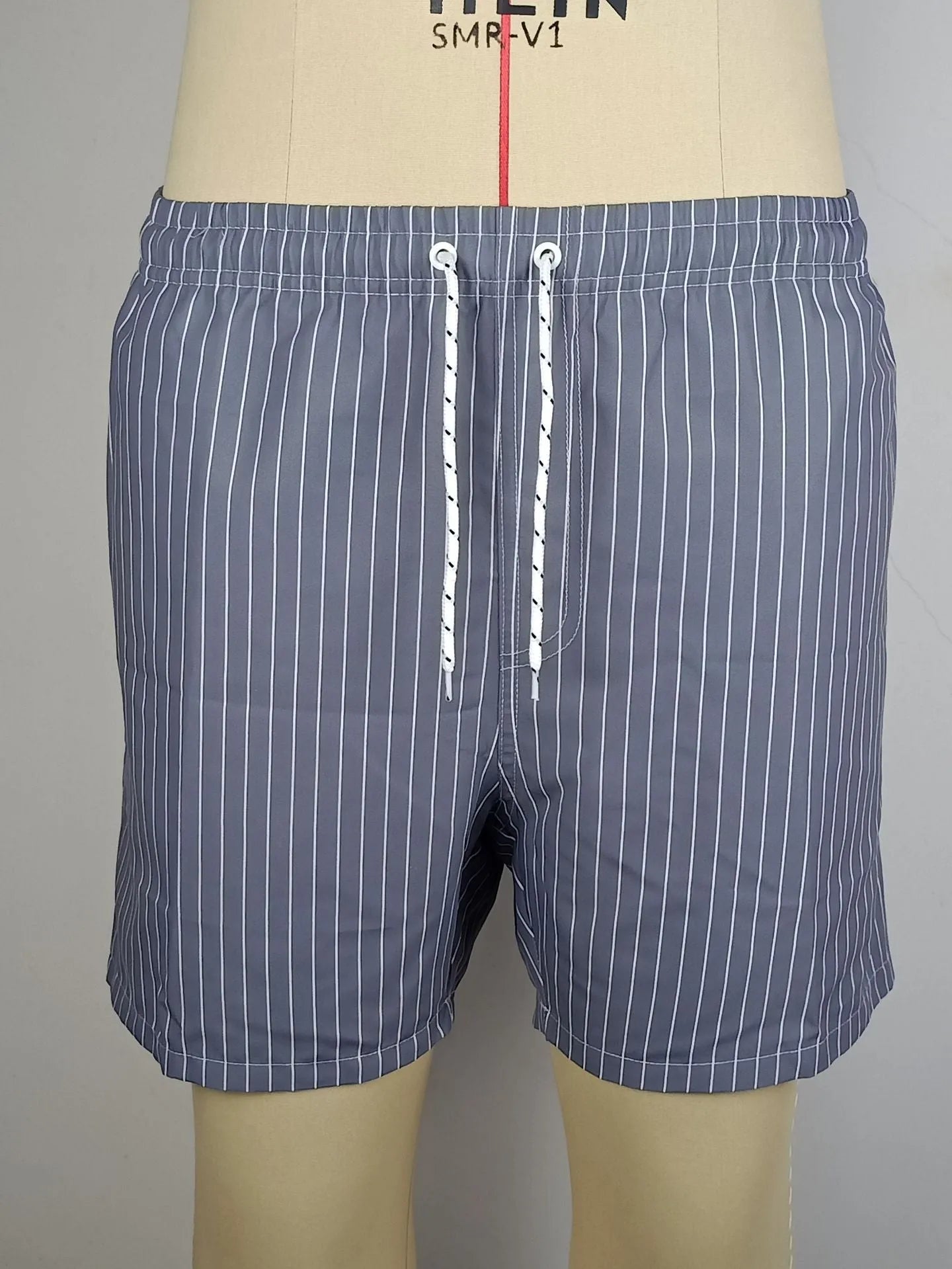 Men's striped polyester shorts with straight leg opening and triangle lining in four colour options