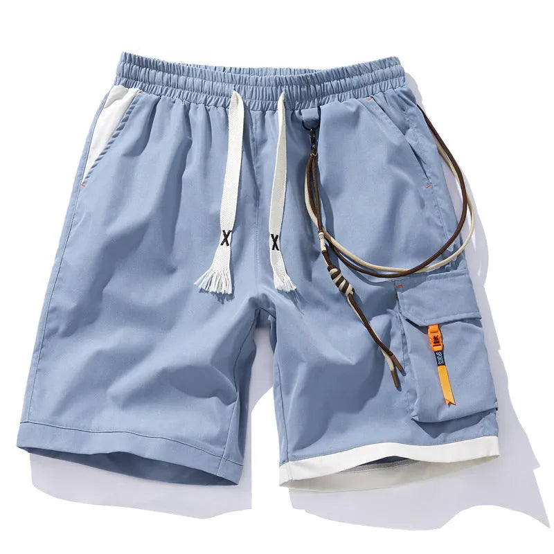 Man wearing coffee-coloured loose-fit bamboo fibre sports shorts with a straight leg and cropped length.