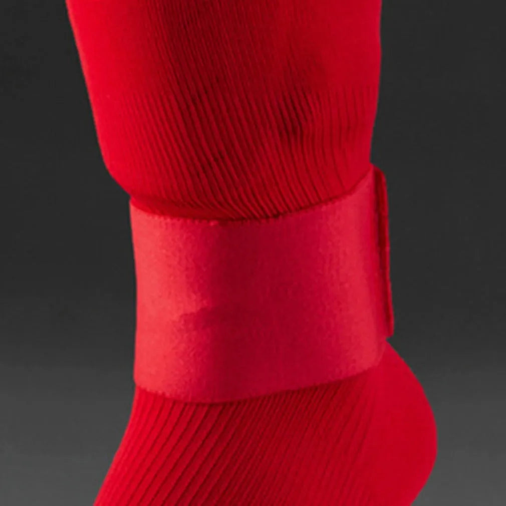 Red elastic rubber shin guard strap band for football sports, dimensions 25cm by 6.5cm.