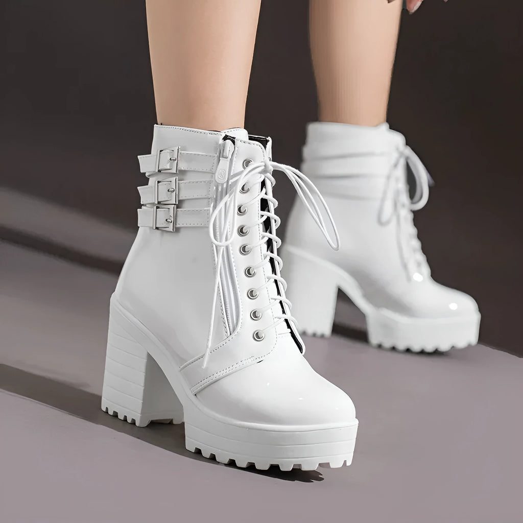 Women's black thick-heeled short boots with lace-up front and round toe on a waterproof platform.
