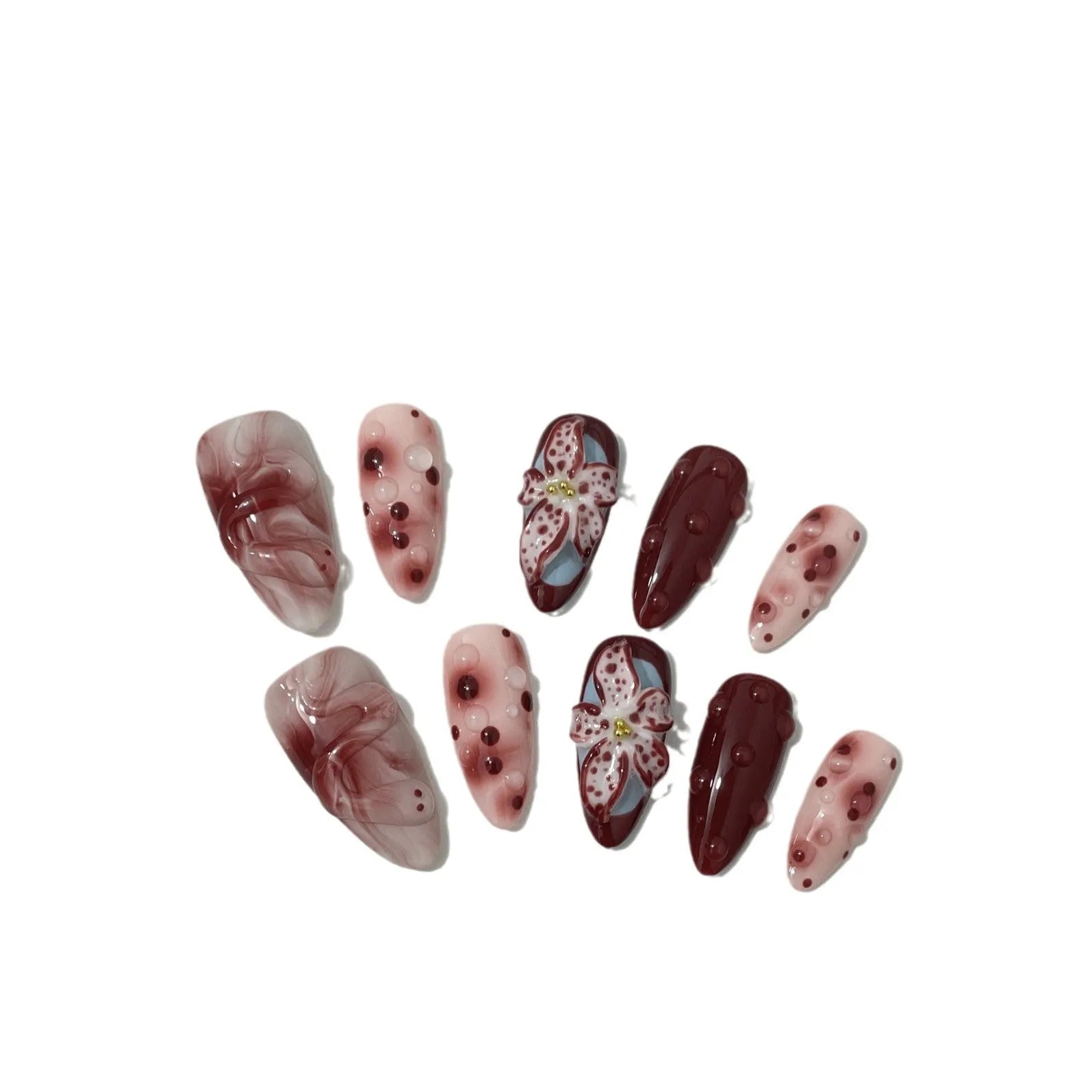 Hand-painted 3D carved manicure nails in almond colour and mid-length almond shape, showing rose and leopard print designs.