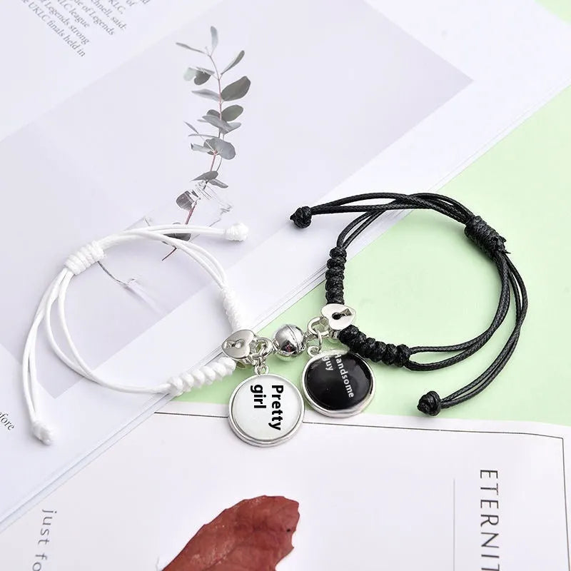 Magnetic clasp couple bracelets with alloy construction and symbolic designs including crown and love lock motifs.