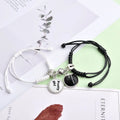 Magnetic clasp couple bracelets with alloy construction and symbolic designs including crown and love lock motifs.