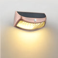 Solar-powered smiling face outdoor wall light for garden decoration