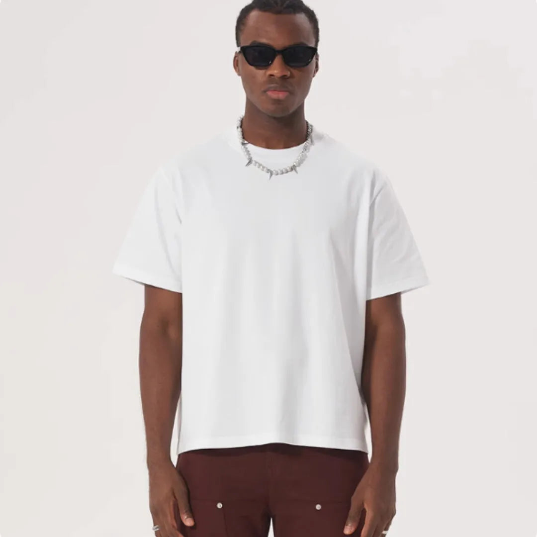 Pure cotton loose fit short sleeve t-shirt in apricot colour on a hanger.