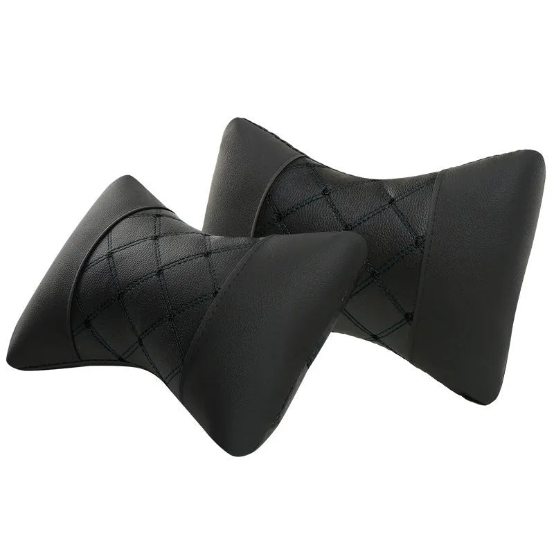 Black quilted diamond pattern car headrest pillow with coloured stitching for neck support.