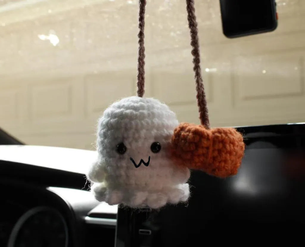 Plush hand-woven polyester automobile hanging ornament with cartoon style design on car dashboard
