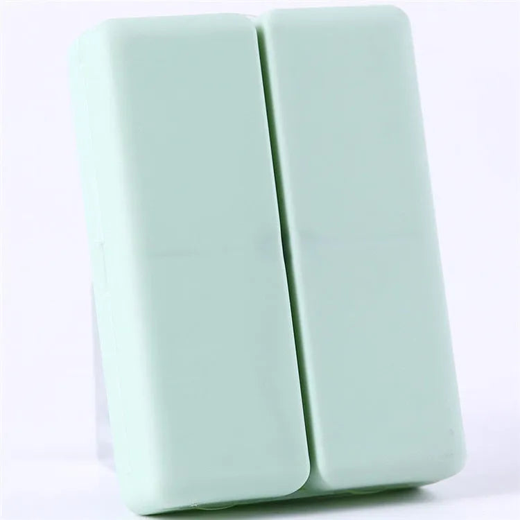 Four-color magnet 7-grid pill box in solid blue colour showing foldable covered design with seven compartments