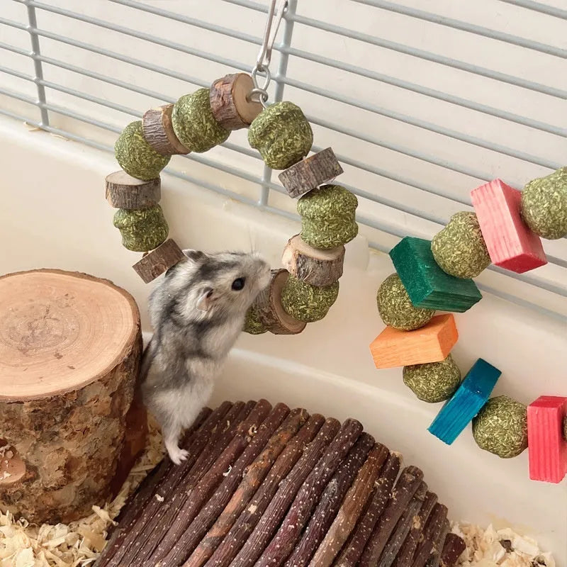 Colourful hamster chewing toy with straw ball rings and applewood rods for small pet dental health