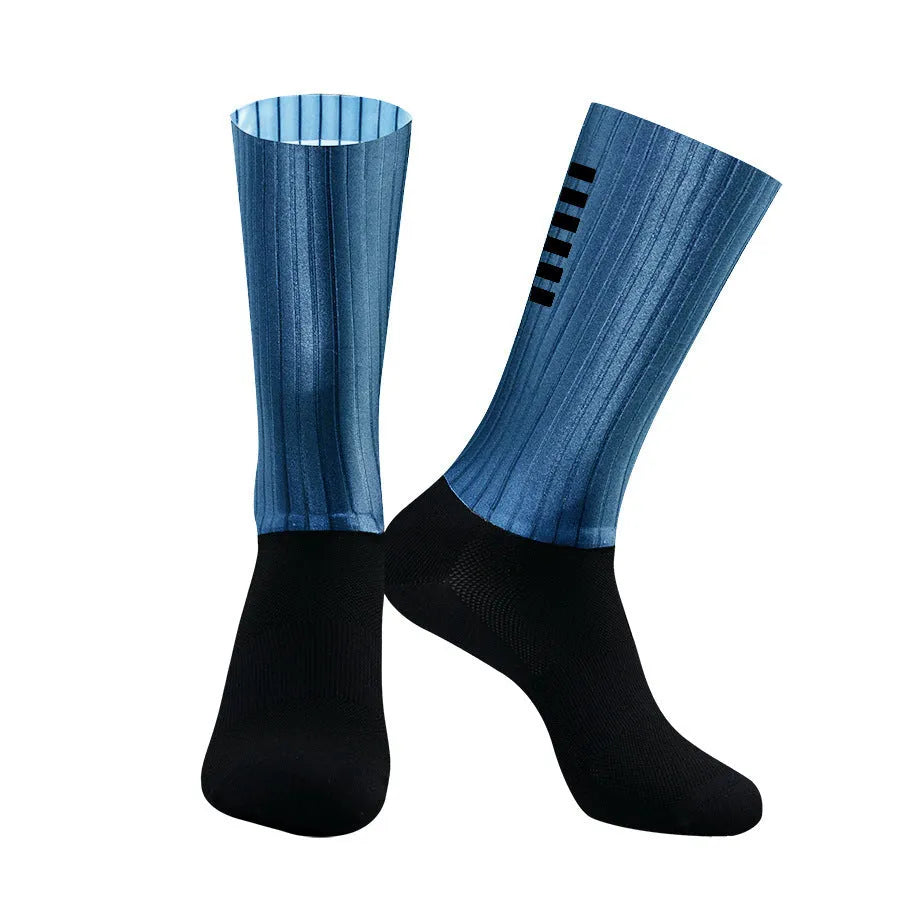 Cycling socks in chemical fibre blend fabric shown in orange, black, purple, white, grey and dark blue colour options