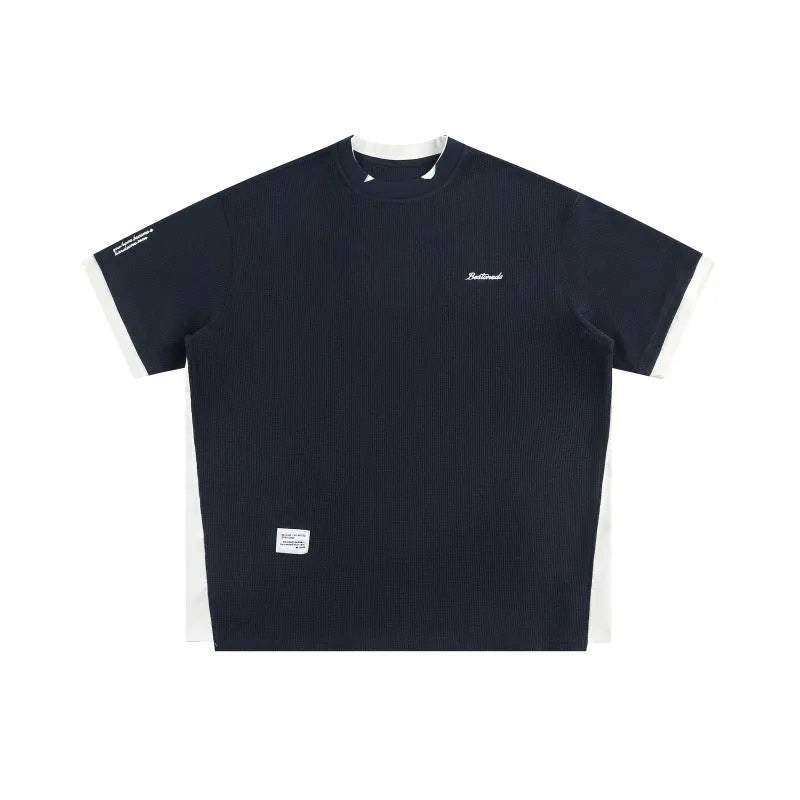 Retro alphabet embroidered loose waffle t-shirt in navy blue, short sleeve pullover style.