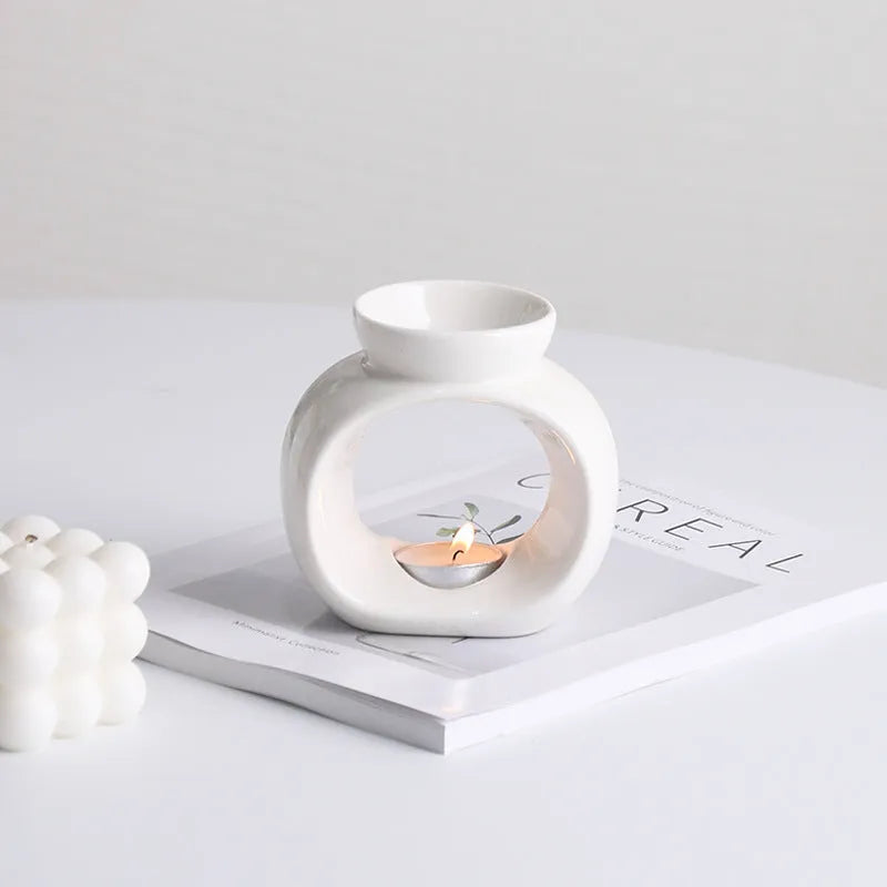 White ceramic Nordic style aromatherapy stove ornament with anti-dry burning design.